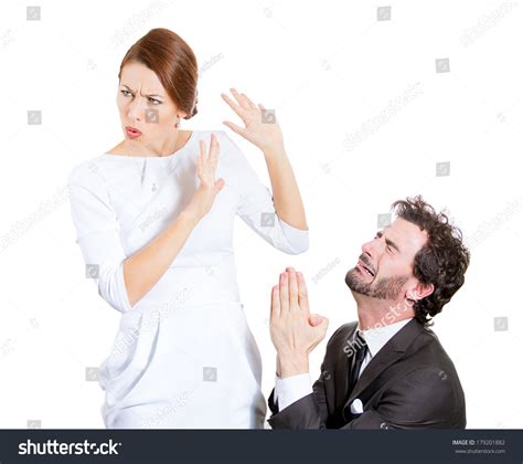 Closeup Portrait Of Couple Man Woman Sad Husband On His Knees Asking Begging For Forgiveness