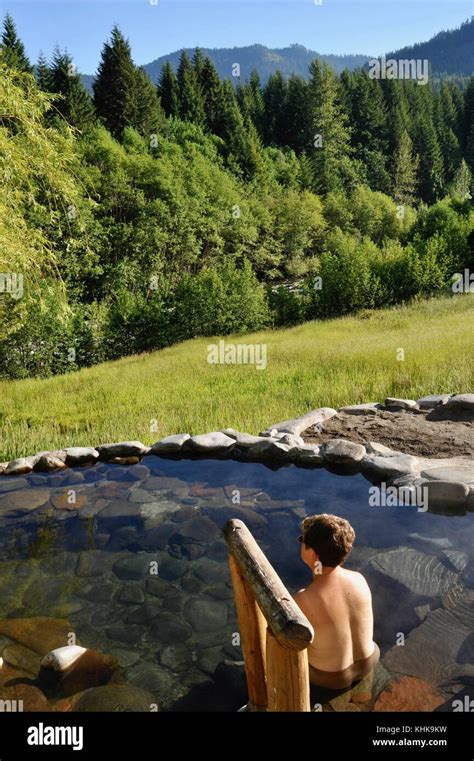 woman soaking in hot spring outdoors at breitenbush hot springs adjacent to mt hood national