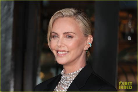 Charlize Theron Wears A Daring Pearl Top For Breitling S Boutique