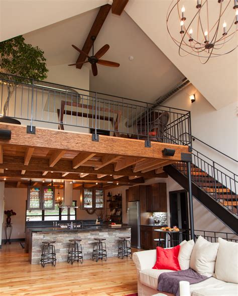A Living Room Filled With Furniture And A Ceiling Fan