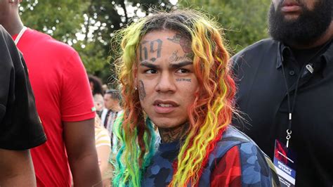 tekashi 6ix9ine gets punched in the head leaving the club