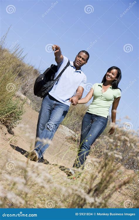 Couple Walking On Path Holding Hands And Smiling Stock Photo Image Of