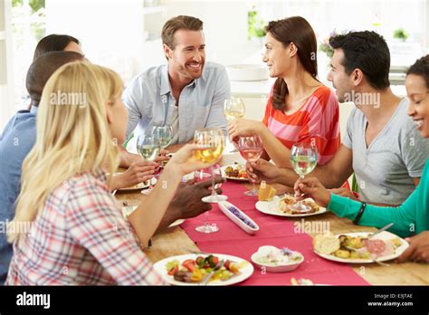 a-multi-ethnic-group-of-people-around-a-table-stock-photos-a-multi-ethnic-group-of-people