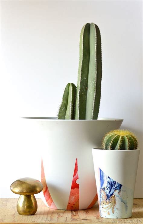 Collection by ♛carol jensen • last updated 12 weeks ago. Spray Paint Marbled Planters | Easy diy gifts, Diy flower ...