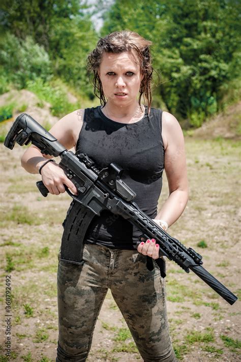Wet Female Army Soldier Hold Rifle Machine Gun Woman With Weapon