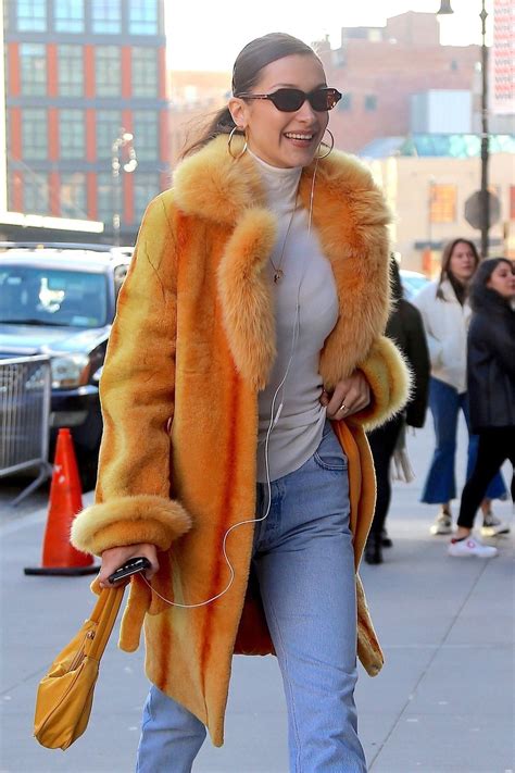 Bella hadid outfits bella hadid style celebrity outfits celebrity style fashion bella star clothing sneakers looks model street style thrift fashion. Striking gold cozy coat over casual top and jeans. | Bella ...