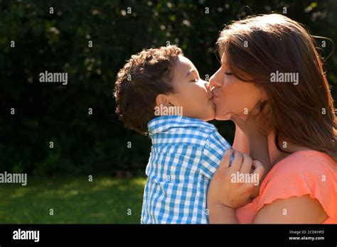 Kiss Mother And Son Stock Photo Alamy