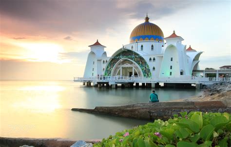 Man looking at the Majestic view of Malacca Straits Mosque during ...