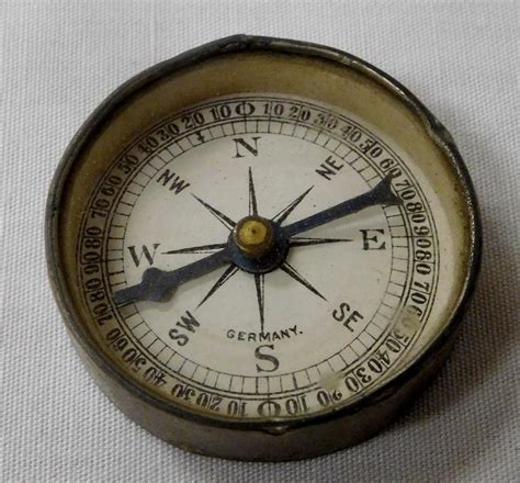 The frontier is a rough and tumble place. Vintage Tin Compass w/ Mirror Back, Made in Germany