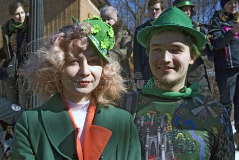 saint patrick`s day celebration in moscow a couple in holiday costumes editorial photography