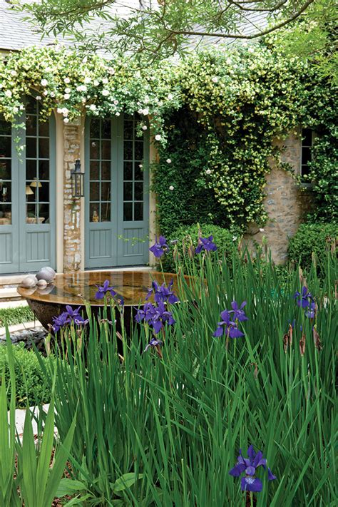 A Country French Garden With Rooted Inheritance Cottage