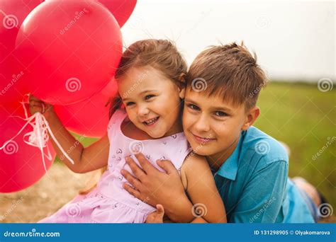 Older Brother Hugs Sister In The Summer In Nature Stock Image Image Of Girl Summer 131298905