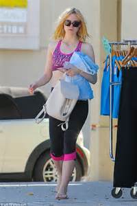 Elle Fanning Shows Off Her Taut Tummy In Sports Bra And