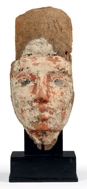 An Egyptian Gesso Painted Wood Mummy Mask