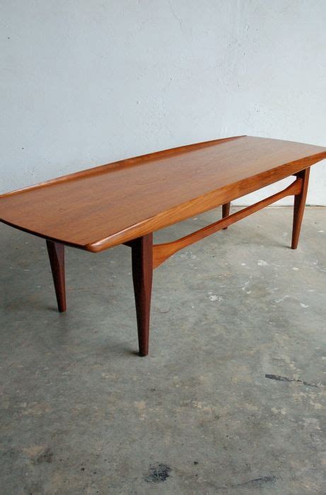 Danish modern teak coffee table with cane rack $ 1,925; Pin on Furniture