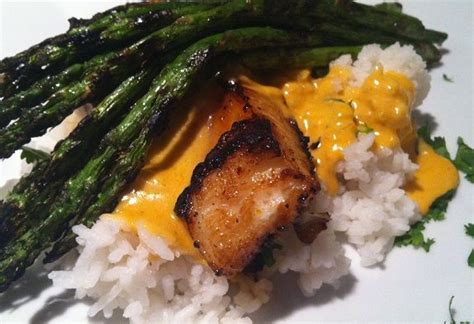 Sake Marinated Sea Bass With Grilled Asparagus Atop Coconut Curry And Cilantro Jasmine Rice
