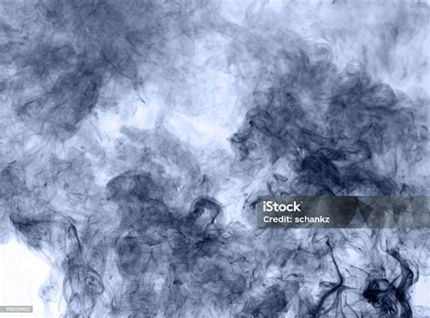 Blue Smoke On A White Background Inversion Stock Photo Download Image