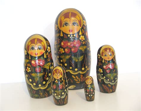 A Group Of Nesting Dolls Sitting Next To Each Other