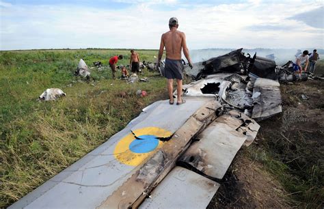 ukrainian military plane is shot down as russia adds to presence at border the new york times