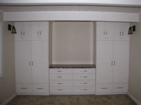 Bedroom Built In Wall Unit With White Painted Wooden Bookcases And