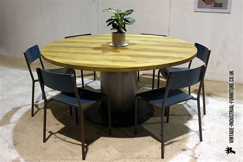 I purchased two of these tables and they are substantial! Vintage Industrial Round Dining Table, Large