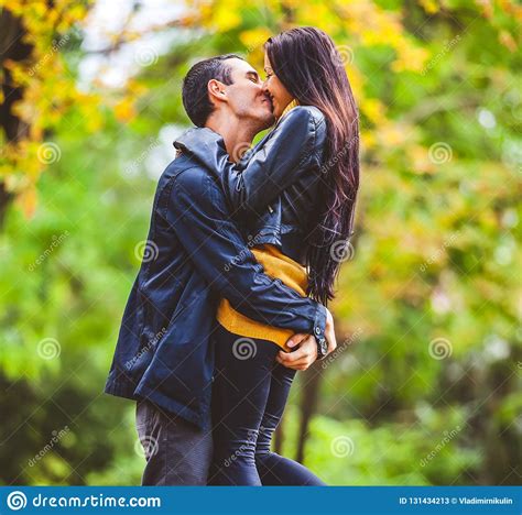Young Couple In Love Kissing In Park Stock Image - Image of nature ...