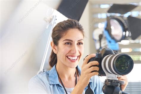Smiling Female Photographer Behind Camera Stock Image F0171531