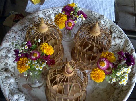 The two blue birds complete the look and casually hint that love is in the air! bird cages centerpieces | Bird cage centerpiece, Table ...