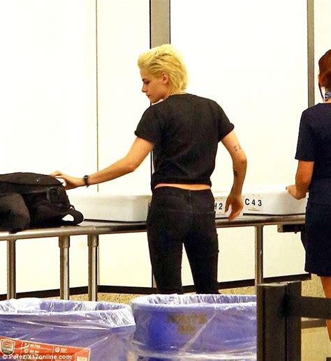 Kristen Stewart Pushes Her Own Luggage Through Security At Lax Airport