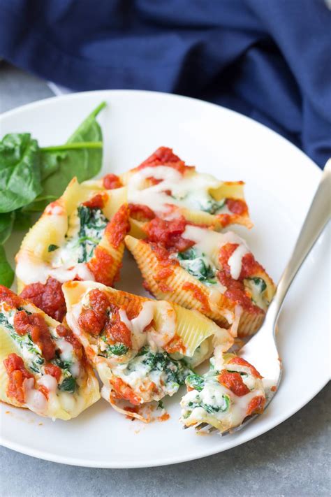 Stuffed shells filled with four cheeses and spinach are a delicious homemade meal that will satisfy any craving for melty, cheesy comfort food. Spinach and Cheese Stuffed Shells - Kristine's Kitchen