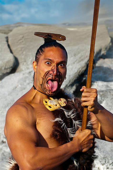 A Maori Warrior With A Ta Moko Facial Tattoo Performs A War Haka