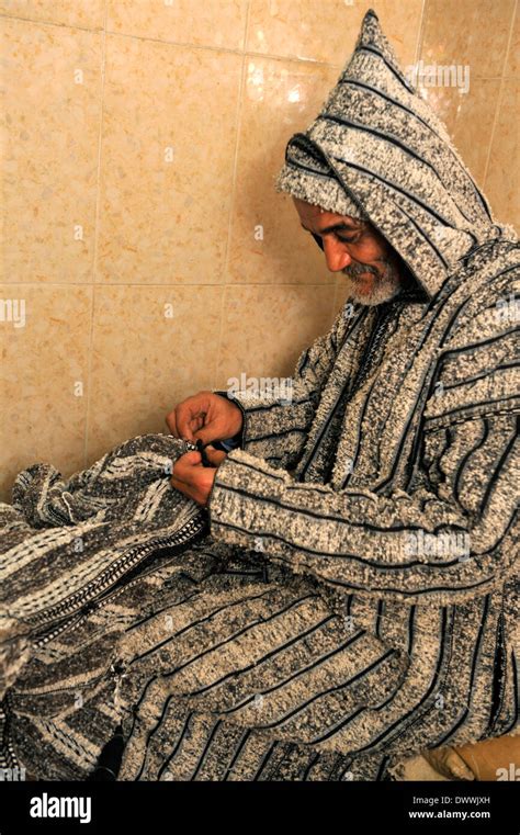 Moroccan Tailor Hand Sewing A Traditional Berber Djellaba In His