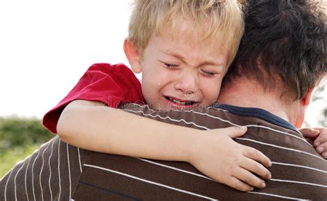 Crying Boy Being Comforted By His Father Stock Photo Image Of Comfort