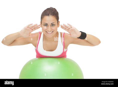 Happy Sporty Brunette Doing Exercise On Exercise Ball Stock Photo Alamy
