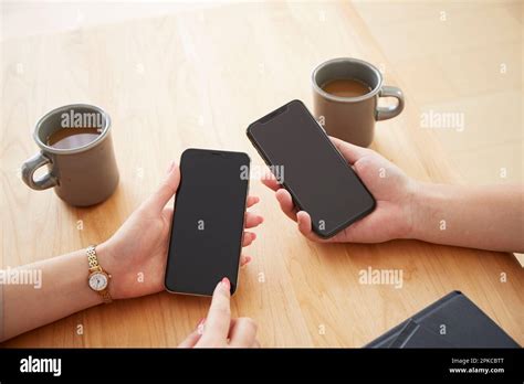 Two Men And A Woman With Smartphones Stock Photo Alamy