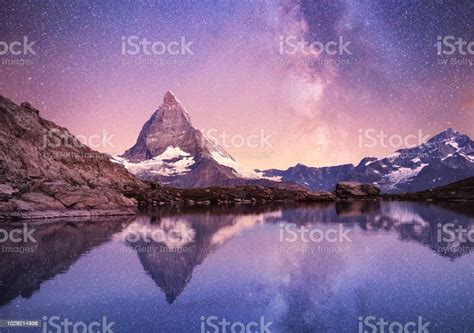 Matterhorn And Reflection On The Water Surface At The Night Time Milky