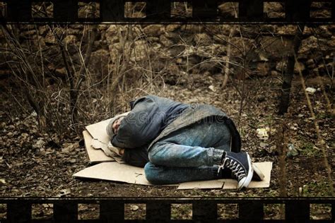 Poor Homeless Man Sleeping On Ground In Park Stock Photo Image Of