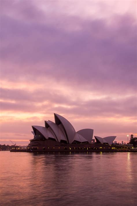 sydney opera house on a pink sunrise morning australia sydney opera house places to go sunrise