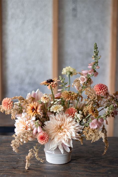 cream peach and soft yellow late autumn wedding centerpiece wedding flower arrangements