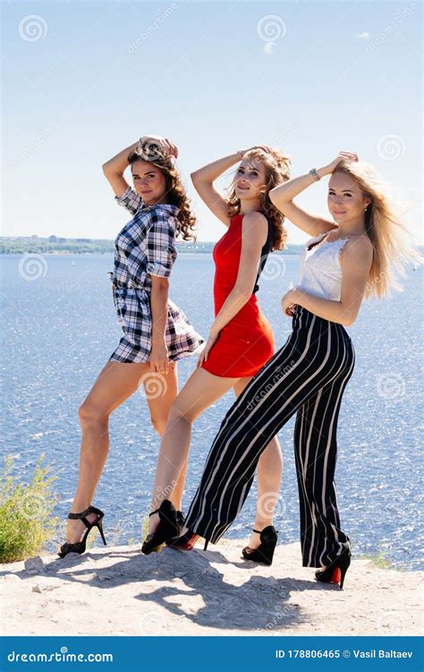 Shoot Of Three Beautiful Girls Outdoors By The River Female Friends