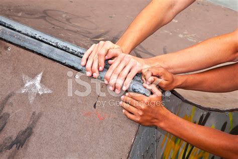Boys Are Pushing A Ramp With Hands To Another Place Stock Photo