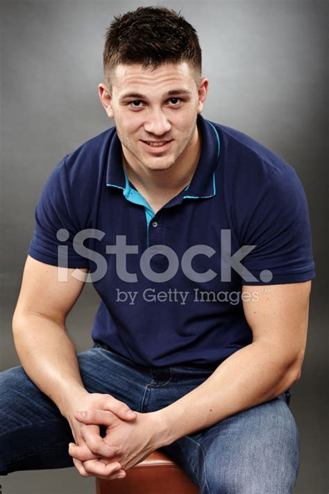 Handsome Young Man Sitting Down Stock Photo Royalty Free Freeimages