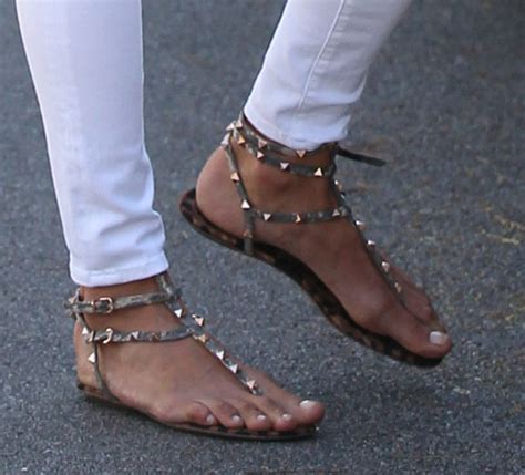 Alessandra Ambrosio In White Ripped Jeans And Valentino Rockstud Sandals