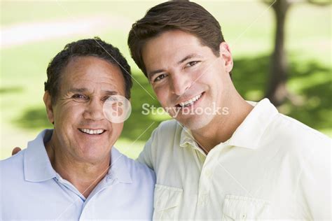 Two Men Standing Outdoors Smiling Royalty Free Stock Image Storyblocks