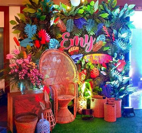 A Room Filled With Lots Of Different Types Of Plants And Decorations On The Wall Behind It