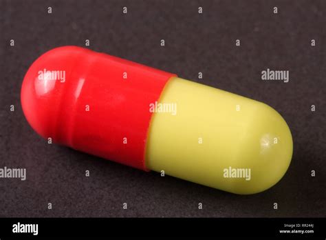 Macro Of Red And Yellow Capsule Pill Isolated Stock Photo Alamy