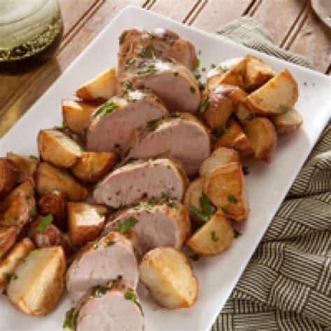 Arrange potatoes, carrots, and bouillon cubes around pork. Easy Pork Tenderloin with Roasted Potatoes | Reynolds Kitchens