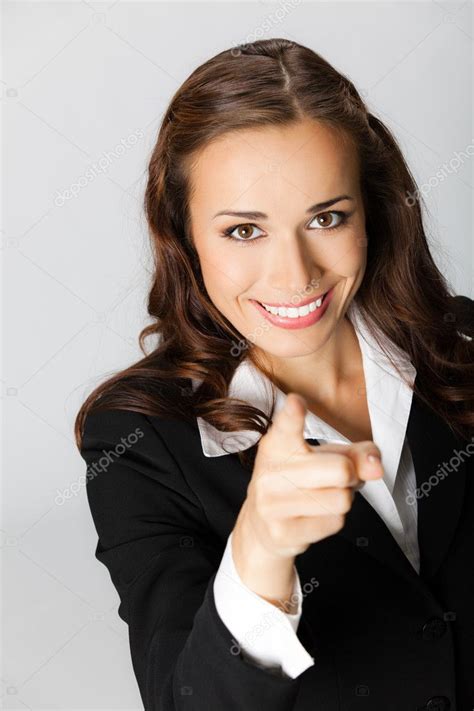 Business Woman Pointing Finger At Viewer Over Grey Stock Photo By ©g