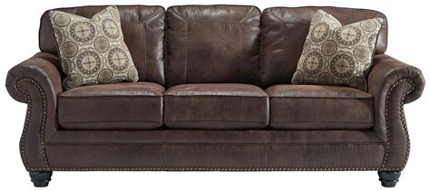Breville Faux Leather Sofa With Rolled Arms And Nailhead Trim By Ashley