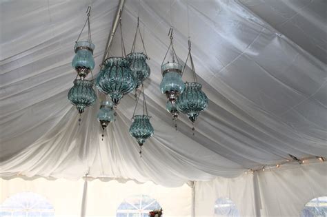 Tiffany Blue Lanterns Hanging From The Tent Ceiling Through The Satin